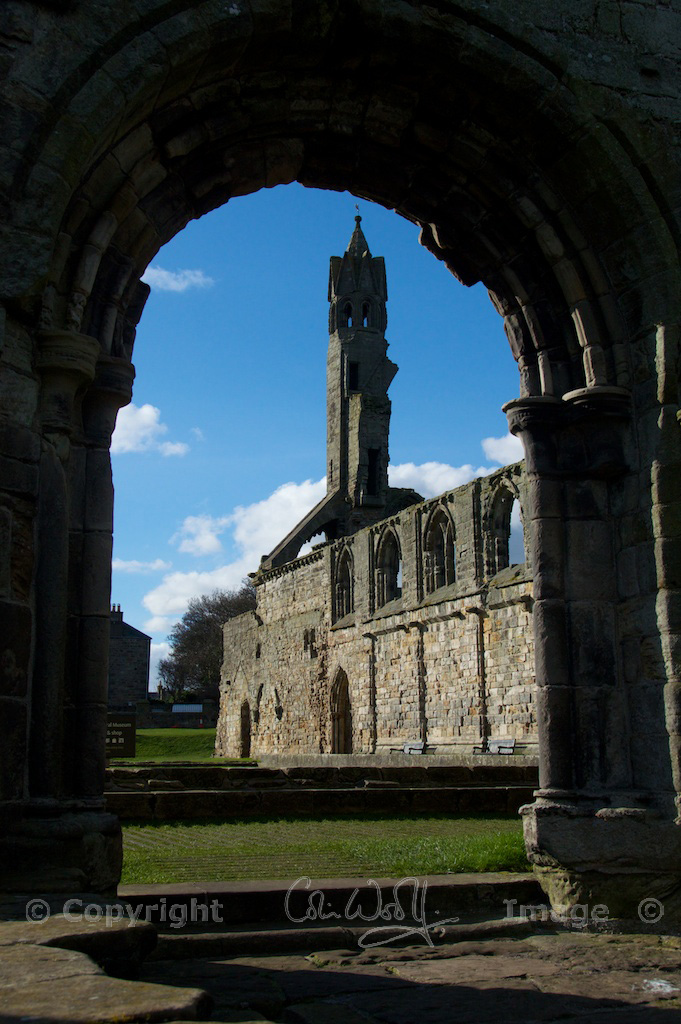 The west end and cloister, viewed through an arch
